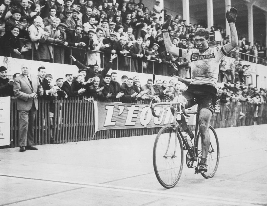 Italian cyclist Felice Gimondi throws up his arms in celebration after crossing the line to win the Paris-Roubaix