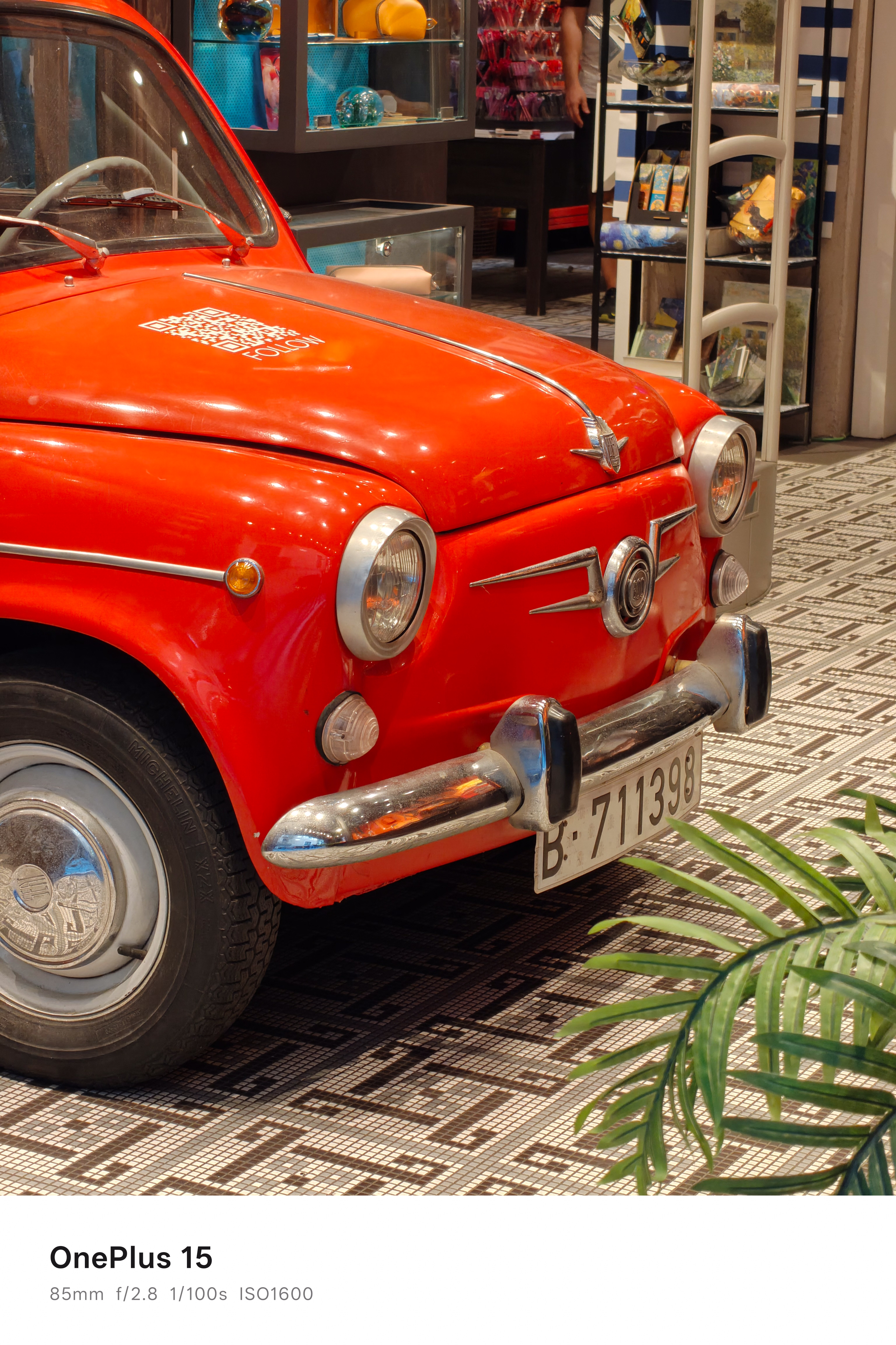 The front and bonnet of an old vintage car in a store