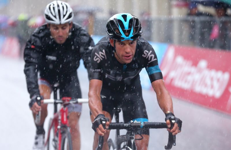 A sodden Richie Porte (Team Sky) crosses the line