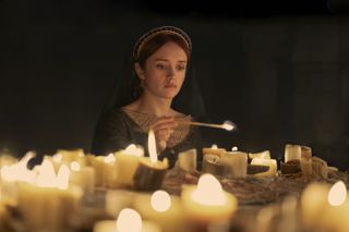 Olivia Cooke as Alicent Hightower, lighting candles, in 'House of the Dragon' season 2