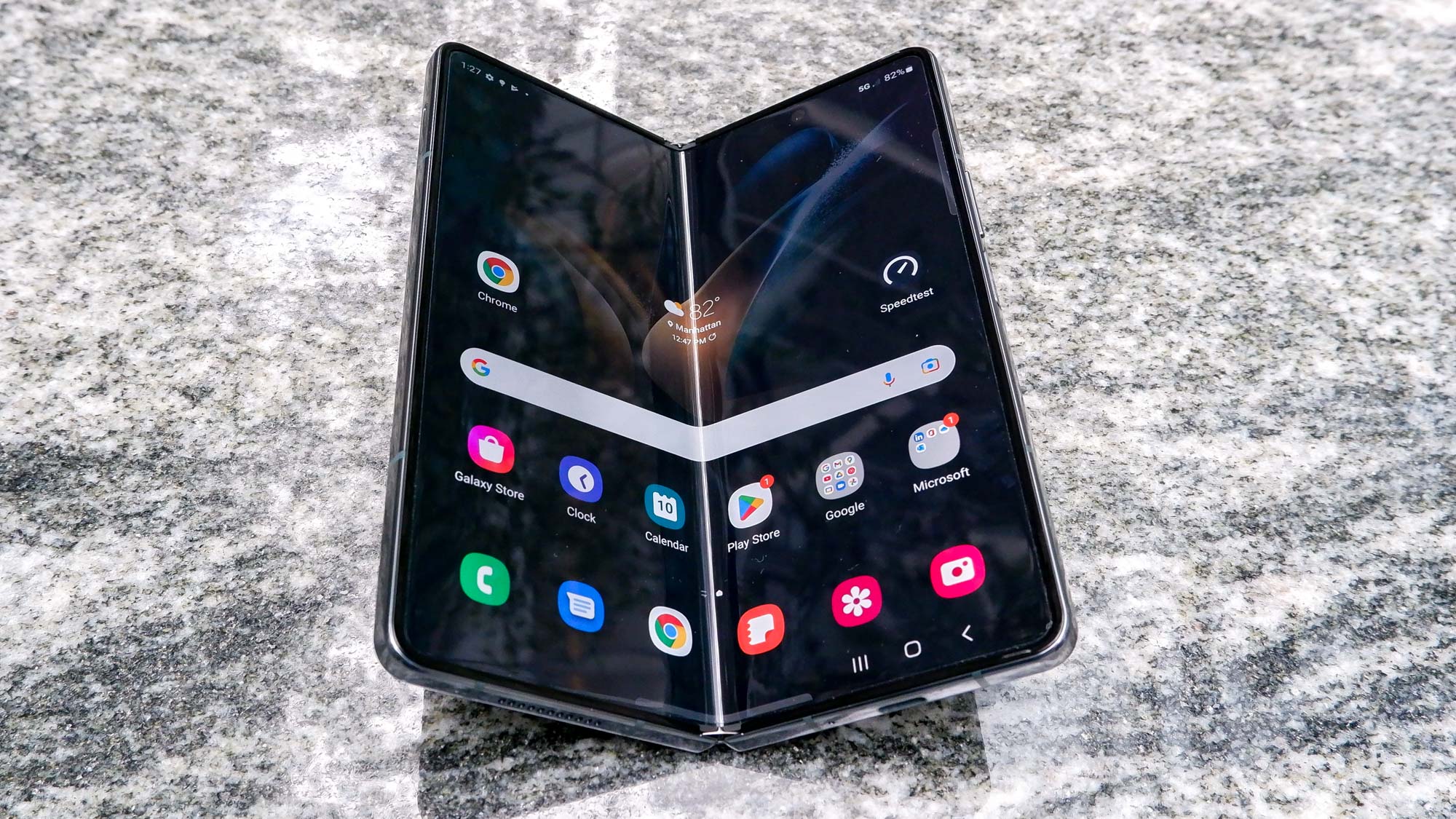 Samsung Galaxy Z Fold 4 mid fold on a bench