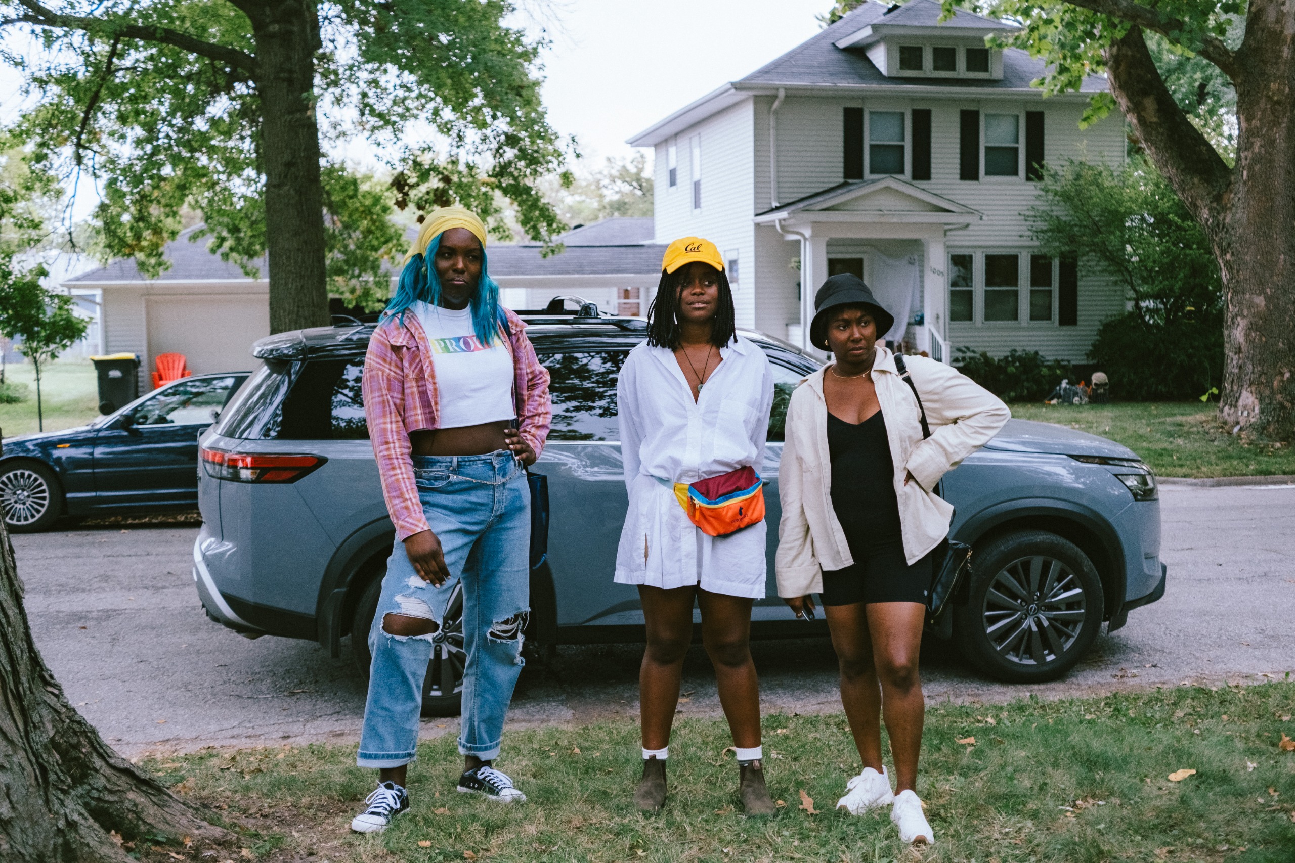 Dezi Bing, Den&amp;eacute;e Benton, and Sasha Comp&amp;egrave;re as lauren z and tasha looking confused as they stand on a front lawn of a suburban street in the movie dreams in nightmares