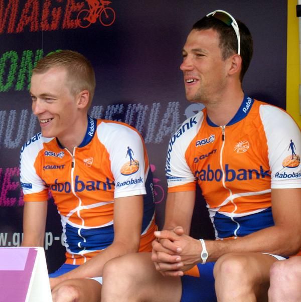 Robert Gesink and Maarten Tjallingii have a laugh on the start podium