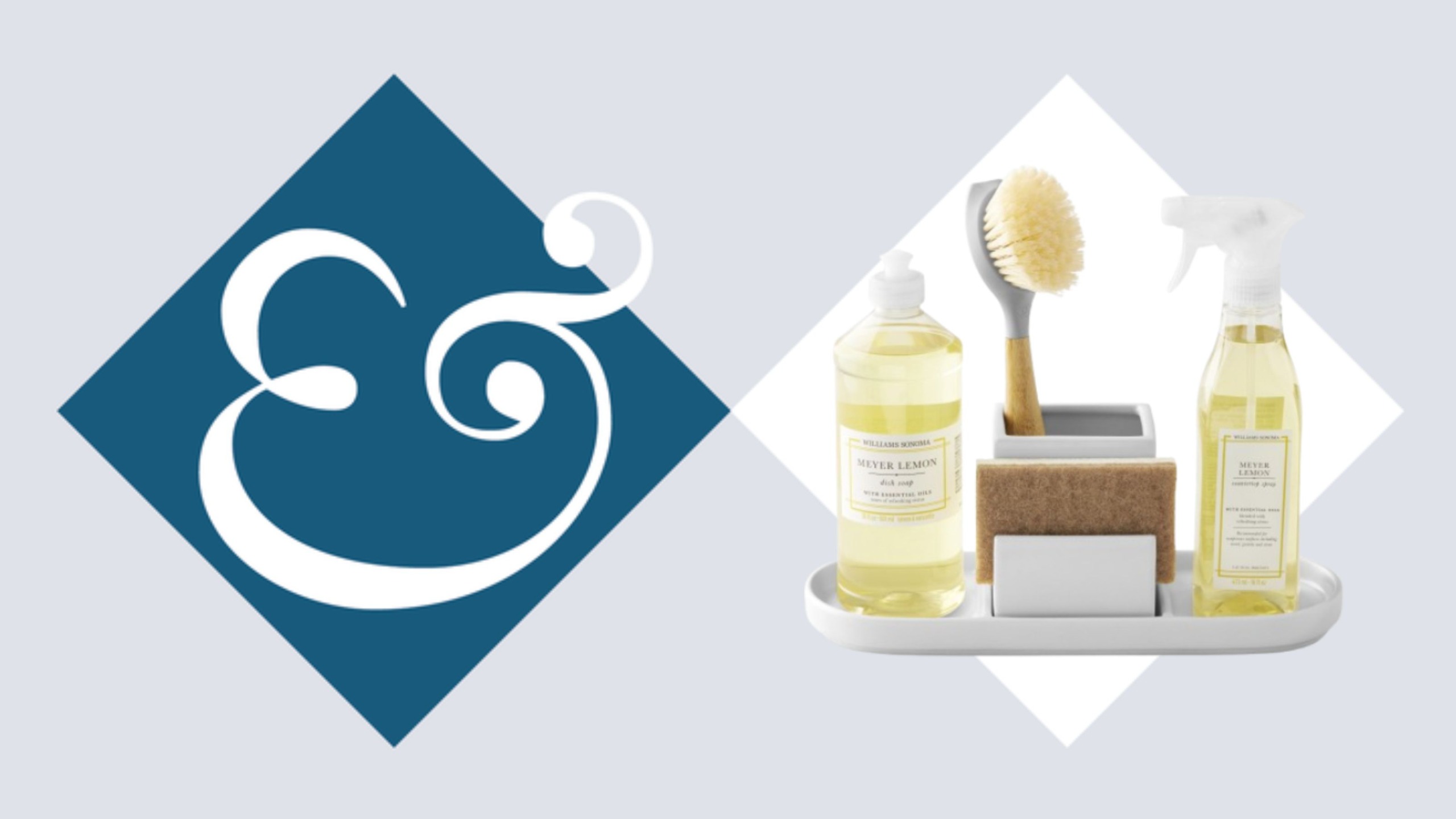 A white sink caddy with two yellow-filled bottles of soap, a dish sponge, and a scrubbing brush. In a white diamond beside a dark blue diamond with an &amp; inside. 