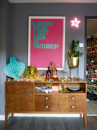 Vintage sideboard with neon Christmas decorations