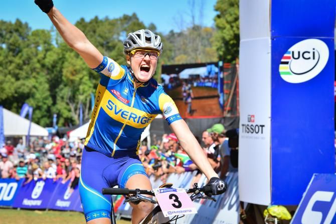 Sweden's Alexandre Engen celebrates winning the women's cross country eliminator title