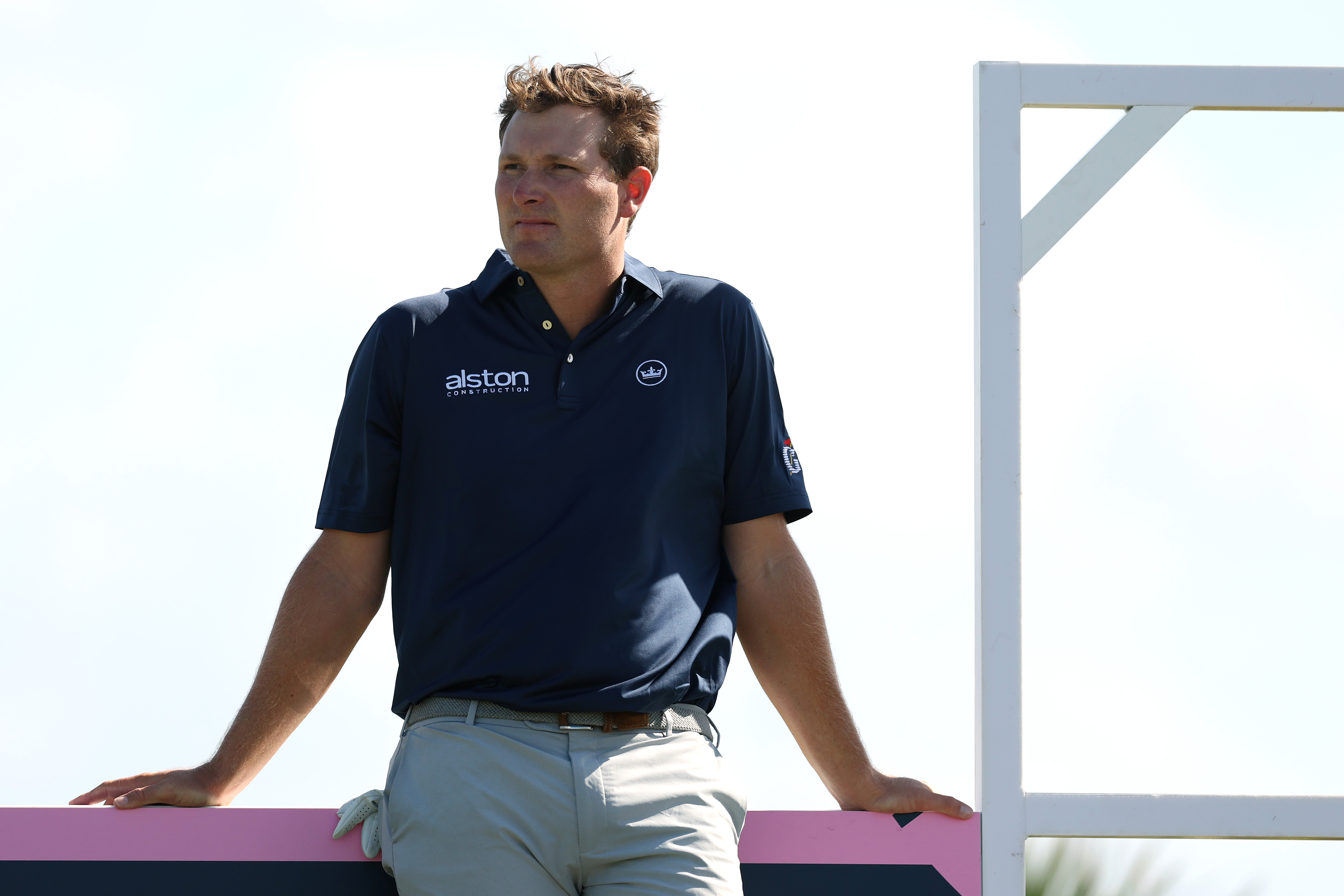 Vince Whaley leans against a fence at the 2025 Butterfield Bermuda Championship