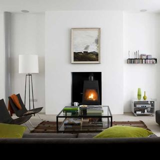 living room with grey sofa and fireplace