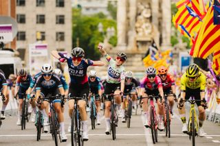 Loes Adegeest (FDJ-SUEZ) wins stage 3 of the Volta a Catalunya Feminas as overall winner Demi Vollering celebrates behind her