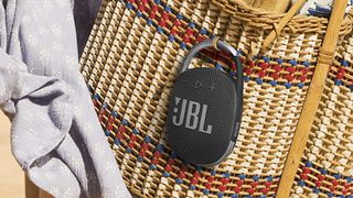 JBL Clip 3 hanging on a shoulder bag