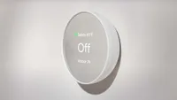 The Nest Thermostat on a white background