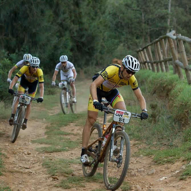Jaroslav Kulhavy and Chritoph Sauser of Team Burry Stander-Songo break away early on with Nino Schurter and Florian Vogel of team Scott-Swisspower MTB