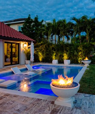 pool with fire bowls