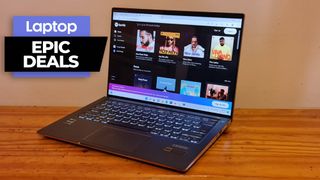 Memorial Day deals on laptops Acer Swift 5 on a wooden desk against orange background