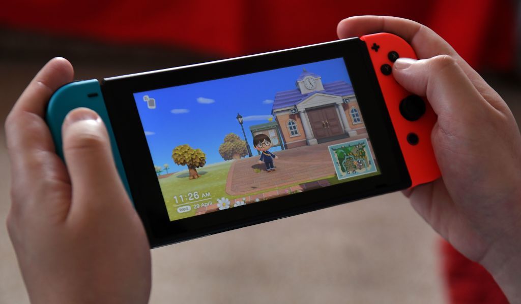 This photo taken on April 29, 2020 shows Australian high school teacher Dante Gabriele playing Nintendo&amp;#039;s Animal Crossing at home in Melbourne during the country&amp;#039;s enforced COVID-19 coronavir