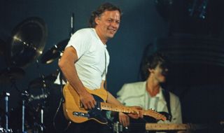 David Gilmour performs with Pink Floyd on stage at Wembley Stadium on August 5, 1988 in London