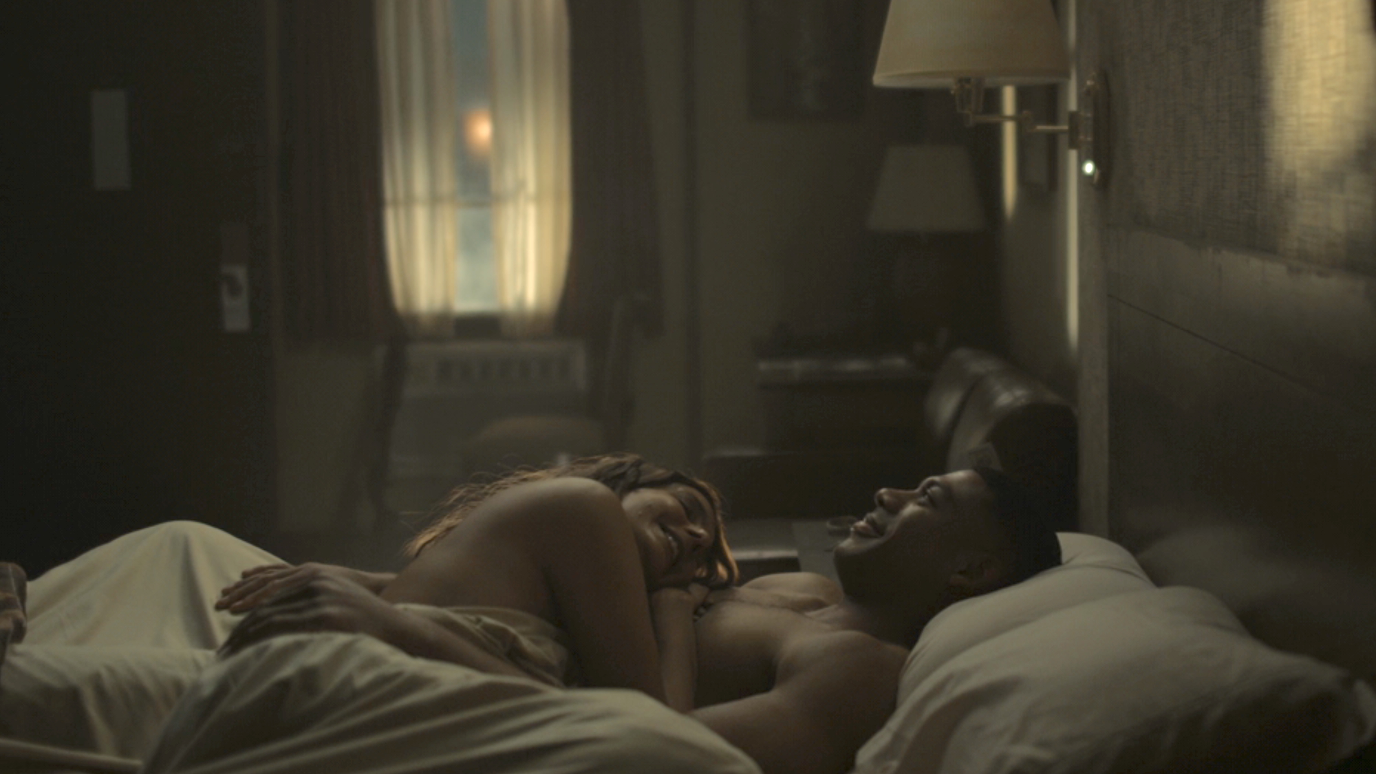 John and Zoe laying in hotel bed post-coitus in Lanterns Season 1