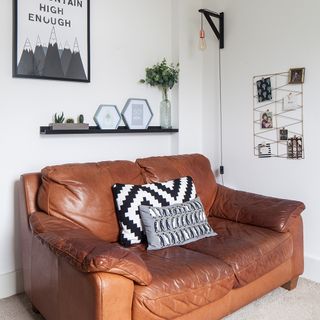 snug area with white wall and sofa and shelf