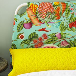 bed with yellow colour pillow