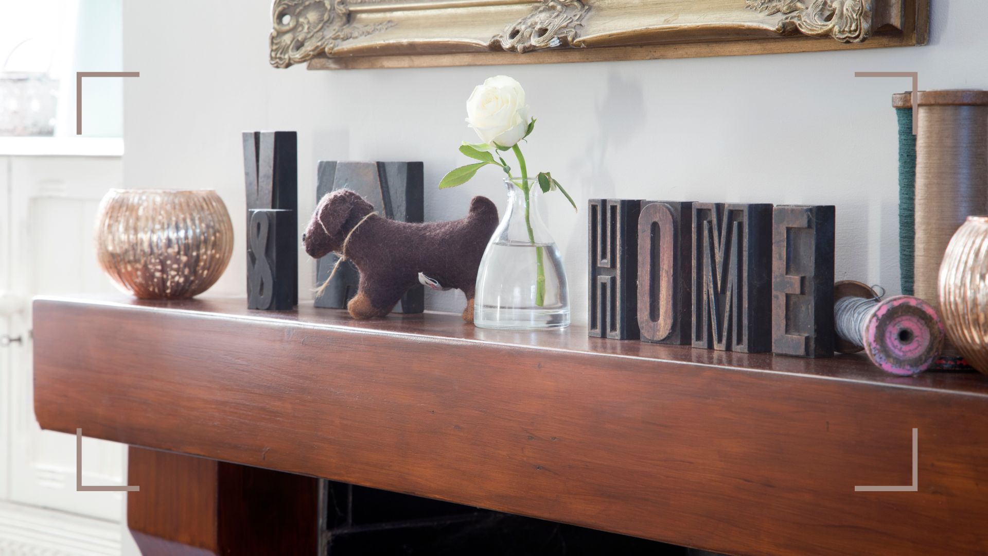 picture of wooden mantel with accessories displayed across it