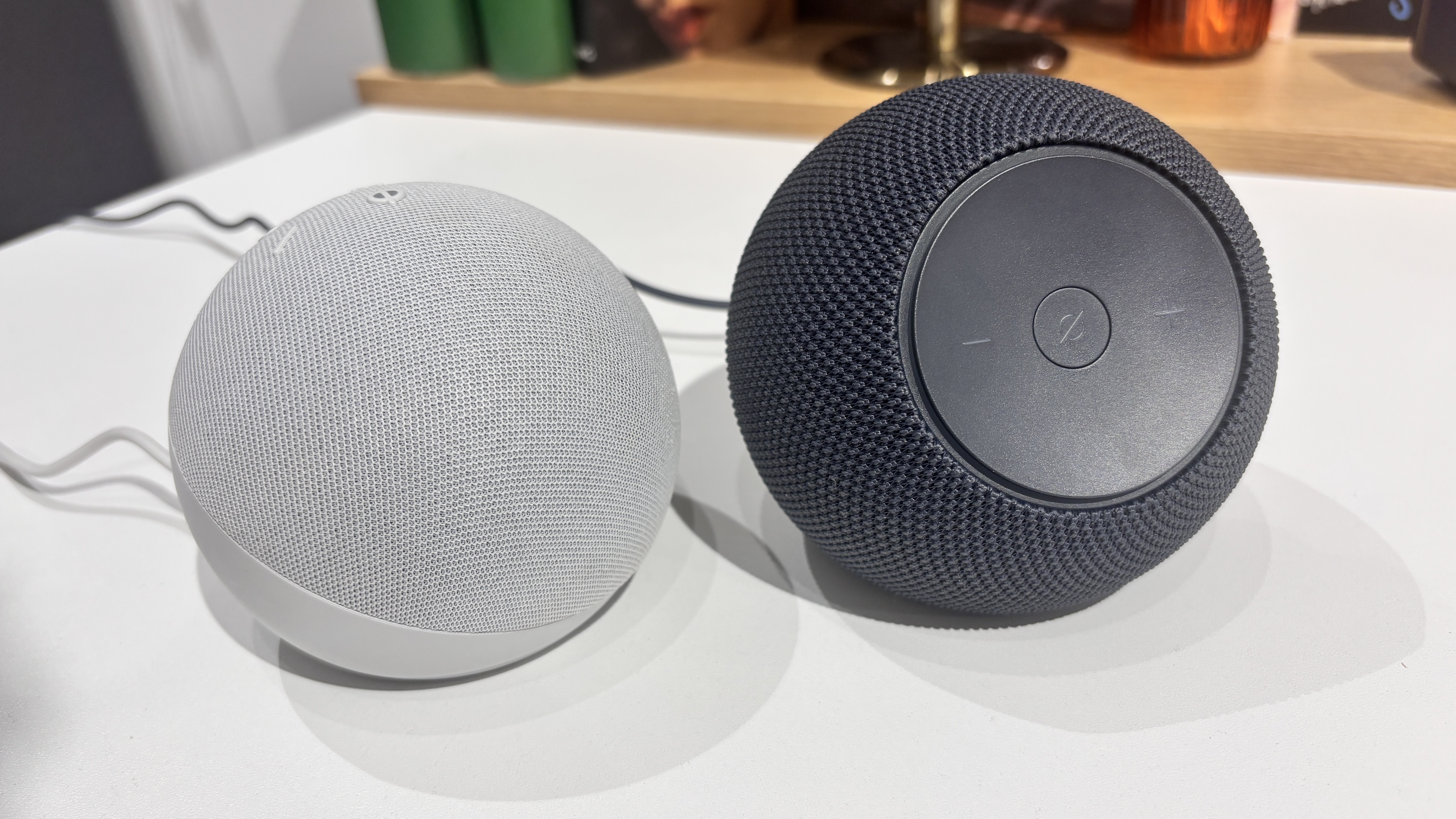 Amazon Echo Dot 5th Gen vs Echo Dot Max on table