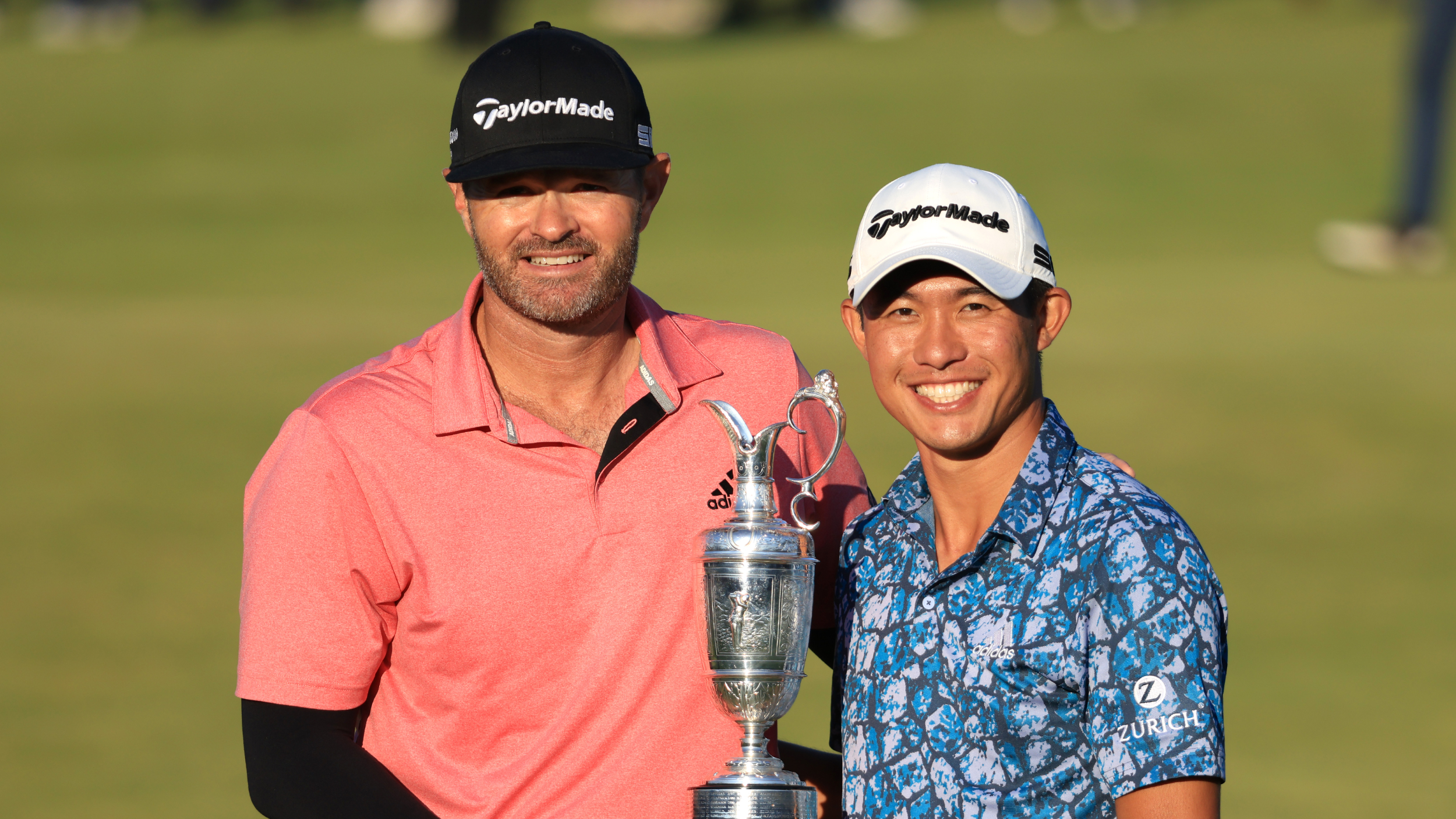 JJ Jakovac and Collin Morikawa pose for a photograph with the Claret Jug