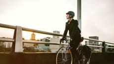 Images shows commuter cyclist wearing helmet