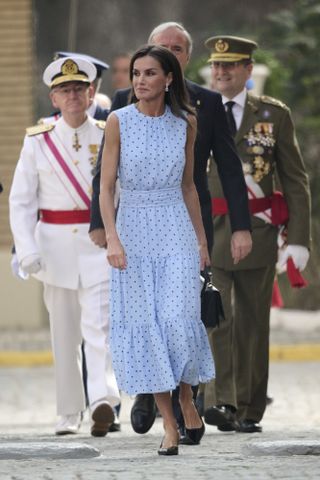 Queen Letizia looked summery and stylish in her high necked polka dot dress