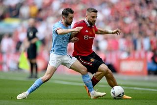 Manchester United's Luke Shaw is challenged by Manchester City's Bernardo Silva in the 2023 FA Cup final at Wembley.