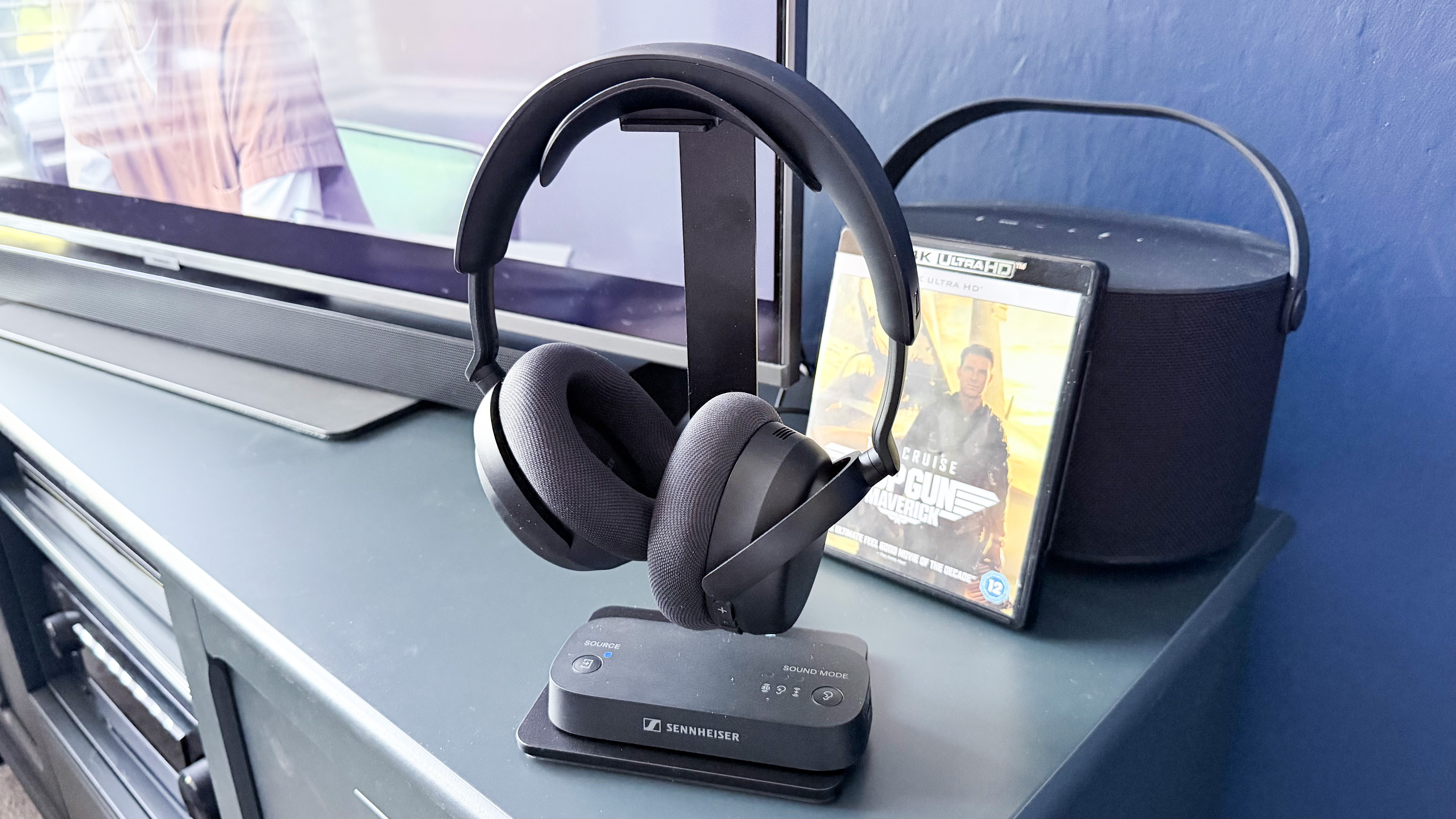 The Sennheiser RS 275 on a TV stand with a Blu-ray box behind