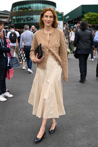 Alexa Chung wears a cotton skirt with black slingbacks.