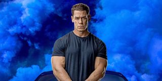 John Cena as Jakob Toretto, standing in front of a car and a blue background, in a promotional image