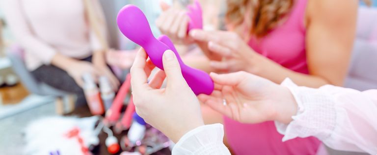 Women Discussing Various Sex Toys And Dildos During Adult Party