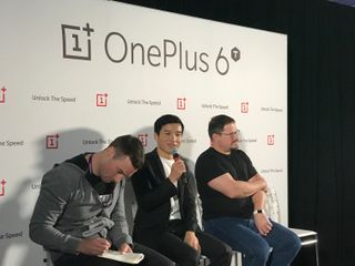 OnePlus CEO Pete Lau, center, talks about the company's 5G plans.