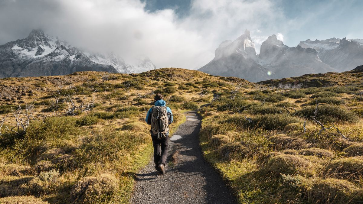 what is backpacking: man hiking in the Torres del Paine National Park, Chile