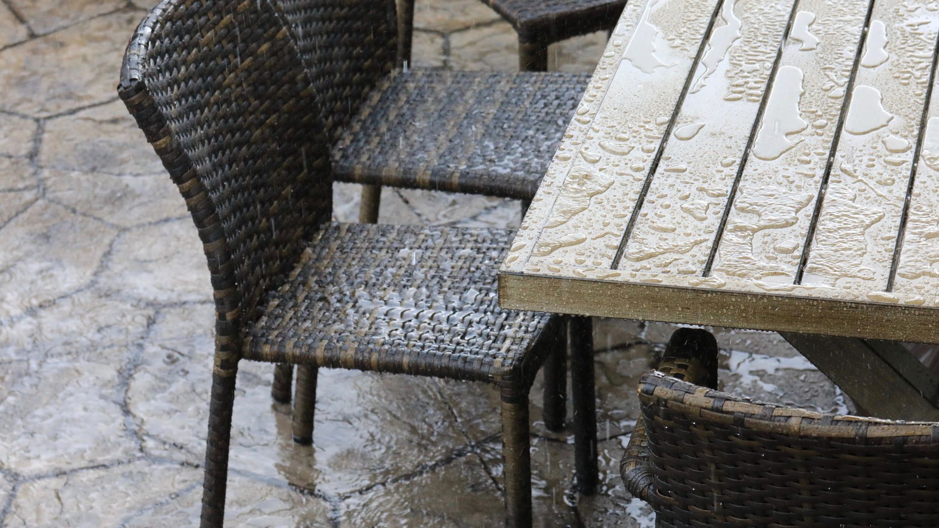 picture of patio furniture covered in rain