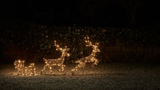 Rattan reindeer light up figurines showing an on-trend outdoor Christmas decorating idea