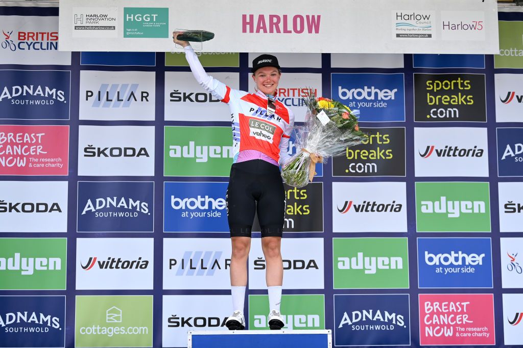 HARLOW ENGLAND JUNE 07 Maike Van Der Duin of Netherlands and Team Le Col Wahoo celebrates winning the red sprints leader on the podium ceremony after the 8th The Womens Tour 2022 Stage 2 a 921km stage from Harlow to Harlow WomensTour UCIWWT on June 07 2022 in Harlow England Photo by Justin SetterfieldGetty Images