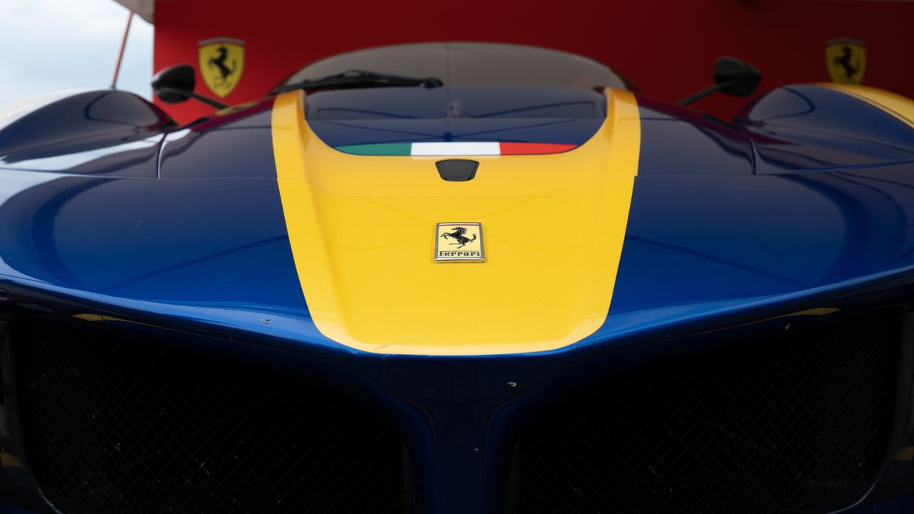 The front of a racing car in the paddocks
