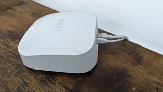 Amazon Eero Pro 6E review: mesh wi-fi router from side angle with wires