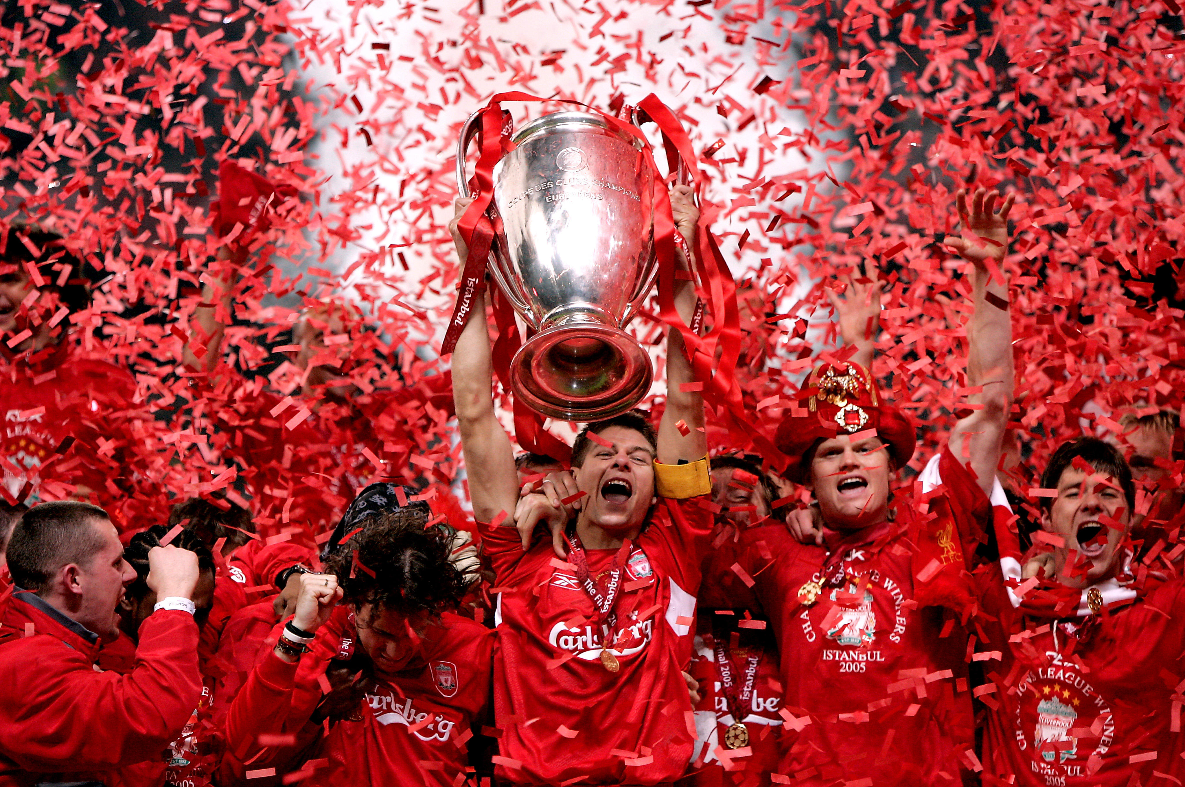 Captain Steven Gerrard lifts the trophy, as red tickertape falls, after Liverpool's victory over Milan in the 2005 Champions League final