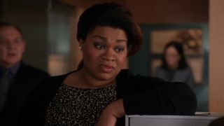 Da’Vine Joy Randolph looking annoyed and leaning against a filing cabinet on The Good Wife.