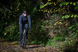 Male cyclist riding Ribble Allroad Ti Pro on a leaf-covered lane