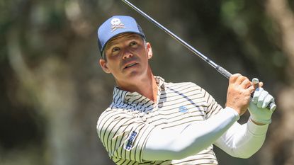 Paul Casey hits a fairway wood shot