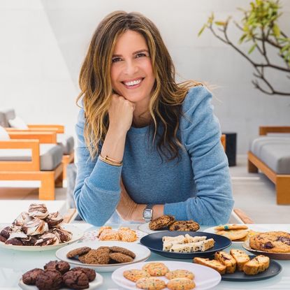 Serial entrepreneur Candace Nelson, founder of Sprinkles, posing with dishes she prepared.
