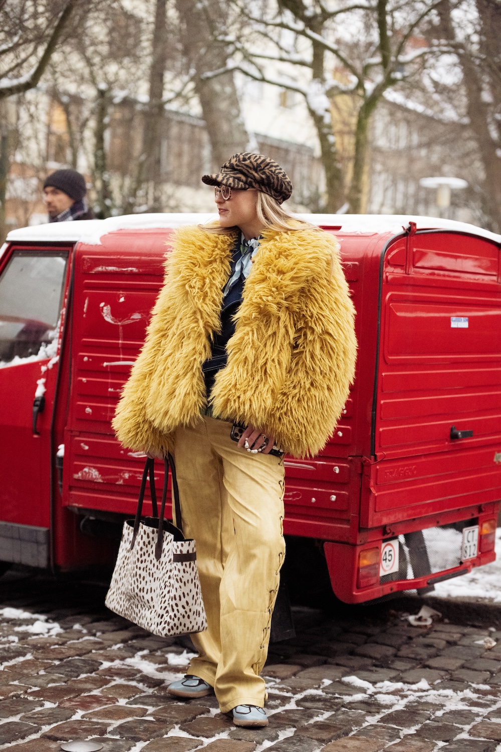 models at copenhagen fashion week wearing fur coats and colorful coats