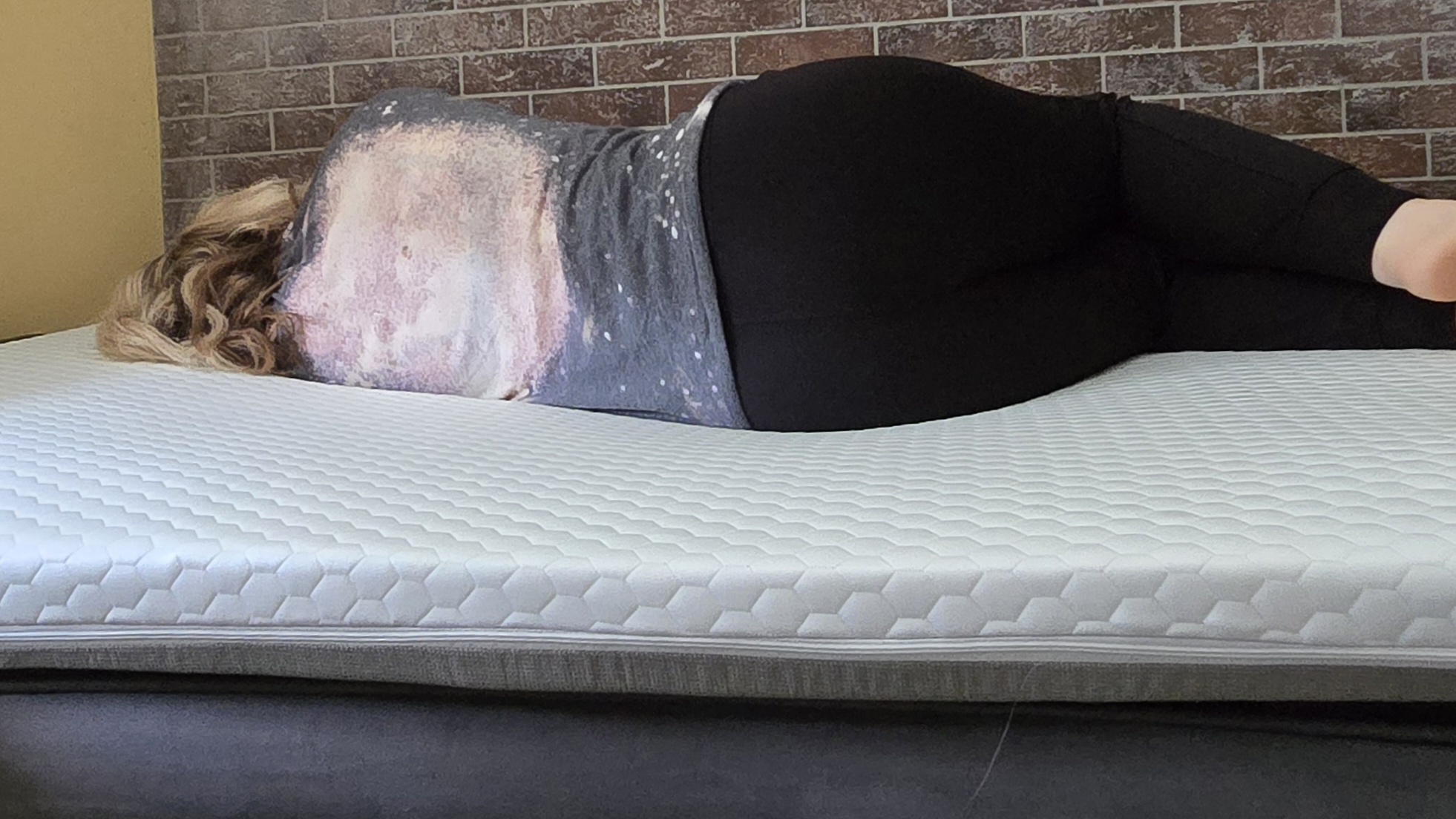 Sleep tester rests in position on the Helix ErgoAlign Mattress Topper.