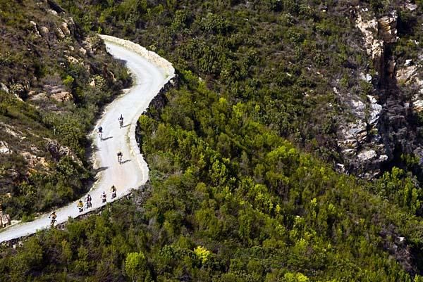 Riders grouped together on a long climb