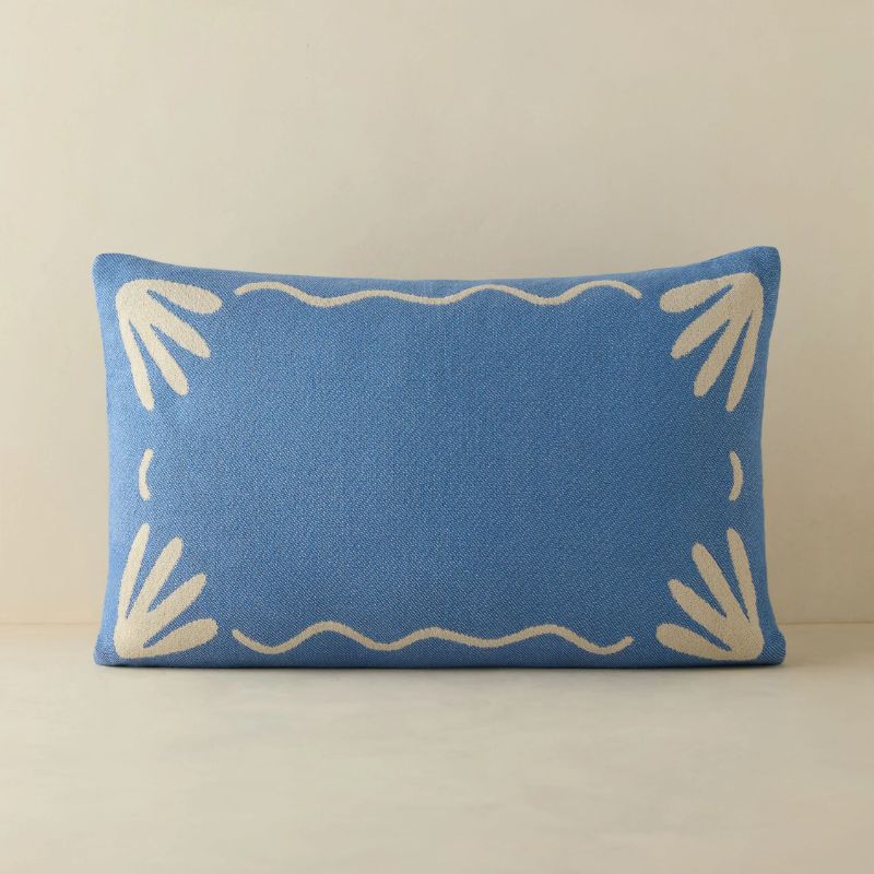blue and white patterned lumbar cushion