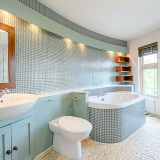 bathroom with bathtub and white sink